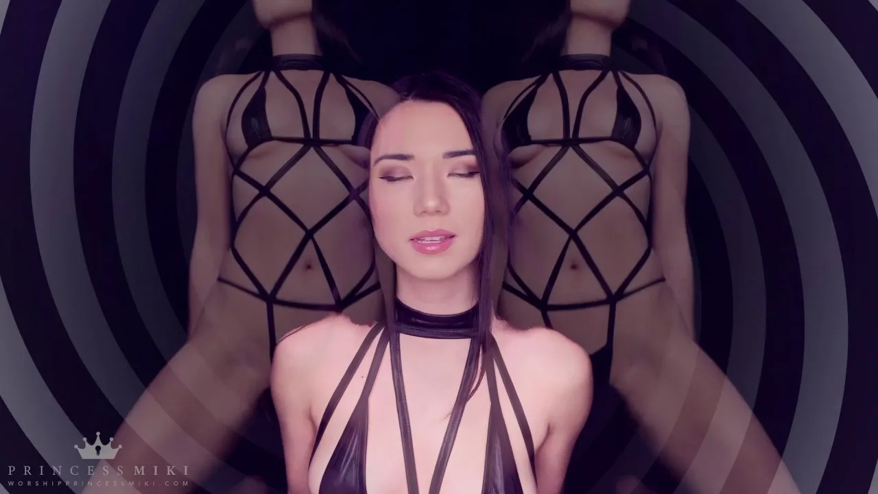 Asian femme in purple-lit studio teases in lingerie, spreads for close