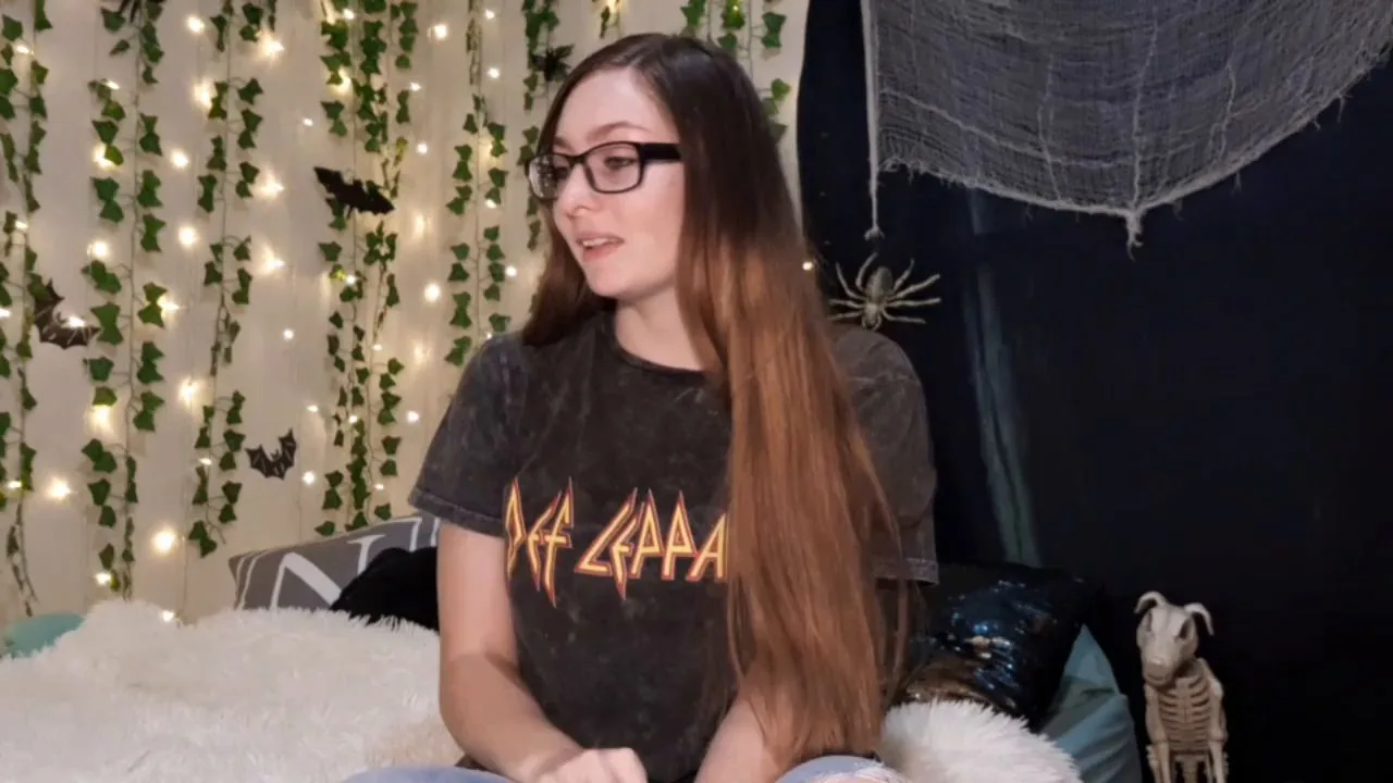 Teen brunette in glasses cooks then sits on bed with phone